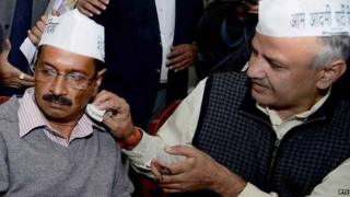 Arvind Kejriwal (left) at a press conference in Delhi on 18 November 2013