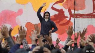 An anti-military protester leads chanting during a rally to commemorate the second anniversary of the deaths of 42 people in clashes with security forces on Mohamed Mahmoud Street, near Tahrir Square in Cairo November 19, 2013