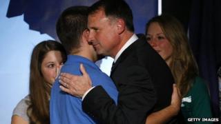 Democratic gubernatorial candidate Creigh Deeds hugs his son Gus as daughters Susannah (L) and Amanda look on following a speech to supporters gathered on election night in Richmond, Virginia 3 November 2009
