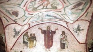 Fresco with a figure with outstretched hands