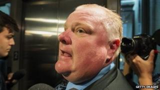Toronto Mayor Rob Ford talks to reporters at city hall on November 15.