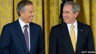 Former Prime Minister Tony Blair and US President George W Bush smile while at the White House in 2009.