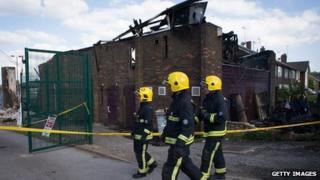 Fire officers survey the fire damaged Bravanese Centre in Muswell Hill London