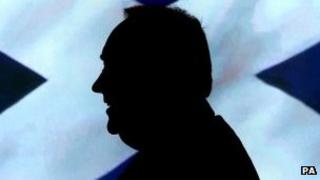 Alex Salmond in front of a Saltire flag
