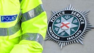PSNI officer and crest