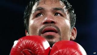 Manny Pacquiao of the Philippines celebrates after winning his WBO international welterweight title fight against Brandon Rios, Nov 24th