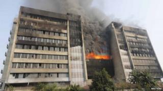Smoke rises from the fire at the Standard Group garment factory in Gazipur