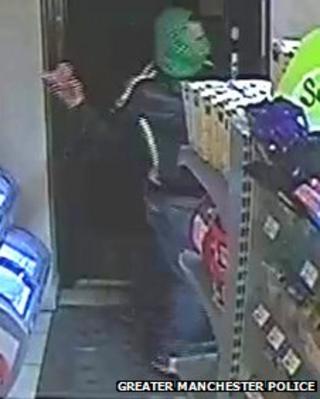 CCTV footage of a man throwing a large piece of raw bacon at an Asian attendant