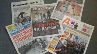 Ukrainian newspapers showing headlines about protests in Kiev