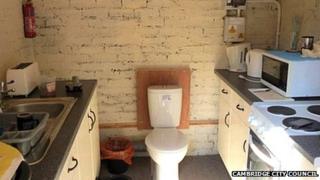 Kitchen with toilet in the middle