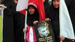 Young protesters hold up a picture of Nabeel Rajab in Malkiya, Bahrain, (3 October 2013)