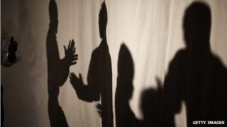 Shadows of people talking