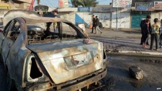 Aftermath of car bombing in Baiyaa, Baghdad (3 December 2013)