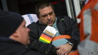Metro-North engineer William Rockefeller Jr. is loaded into an ambulance after a train derailment in the Bronx borough of New York 1 December 2013