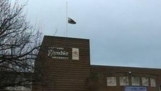 Glyndwr university flag at half mast
