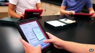 Teenagers with their iPads