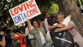 Indian gay activists celebrate the New Delhi High Court ruling decriminalising gay sex, in New Delhi on July 2, 2009.