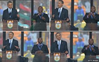 Barack Obama stands next to a sign language interpreter who was widely criticised