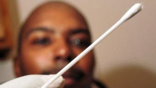 A New Jersey man waits for a doctor to administer a DNA test.