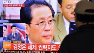 A South Korean watches television coverage of the execution of Chang Song-Thaek.