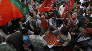 BJP supporters celebrate their party's performance in Delhi