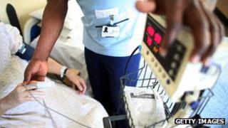 Nurse taking temperature