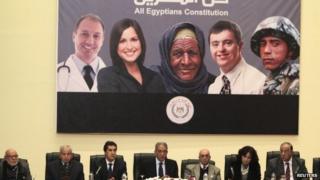 Poster advertising Egypt's draft constitution at a news conference in Cairo (15 December 2013)