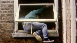 Man breaking into house