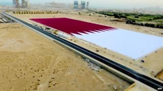 Giant Qatari flag outside Doha