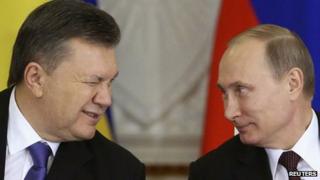 Ukrainian President Viktor Yanukovich (L) gives a wink to his Russian counterpart Vladimir Putin during a signing ceremony after a meeting of the Russian-Ukrainian Interstate Commission at the Kremlin in Moscow.