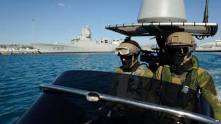 Norwegian marines patrol waters around HNOMS Helge in Cyprus on 14 December 2013