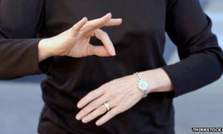 Woman signing. Posed photograph