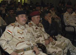 The commander of the Iraqi army's Seventh Division, Maj Gen Mohammed al-Karawi (L), at a conference in Baghdad, 13 December
