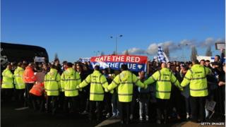 Stewards joined hands to keep the protesters at Cardiff City FC back