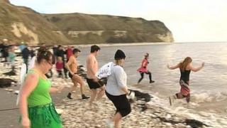 People taking part in the Boxing Day dip at Flamborough