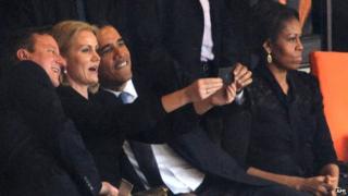 Barack Obama and David Cameron pose for a selfie picture with Denmark's Prime Minister Helle Thorning Schmidt in Johannesburg (December 10, 2013)