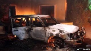 Fires burn in the US Benghazi consulate the day after it was attacked by Libyan militants in 2012.