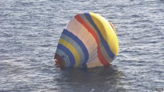 A hot-air balloon drifting in the East China Sea near the disputed isles known as Senkaku in Japan and Diaoyu in China, in a photo released 2 January 2014