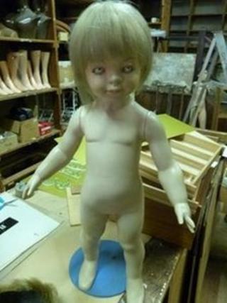 A child-sized shop display mannequin known locally as "Cruella"