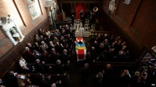 Ronnie Biggs's coffin arrives at Golders Green Crematorium in north London