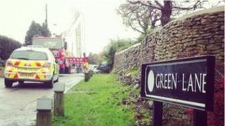 A fire engine and police car at the scene on Green Lane