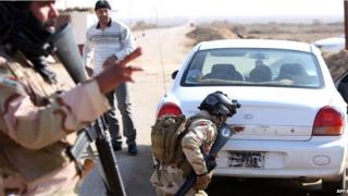military checking car at border