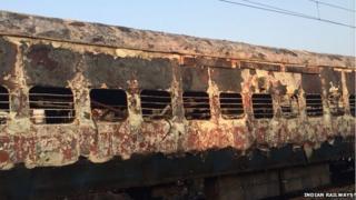The charred coach of the Dehradun Express. 8 January 2013