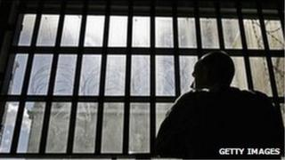 Prisoner looking out of cell window