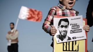 A child calls for the release of Ahmed Fardan at a protest in Bahrain (3 January 2014)