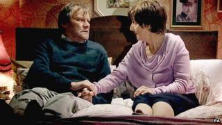 Coronation Street scene featuring Hayley and Roy Cropper, played by Julie Hesmondhalgh and David Neilson.