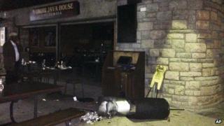 A dustbin and burnt papers at Nairobi Java Coffee cafe at Nairobi's international airport, Kenya