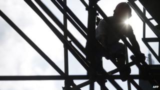 Construction worker on scaffold