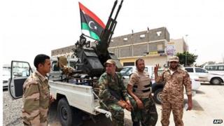 Heavily armed militia surrounding the Libyan Justice Ministry in April 2013.