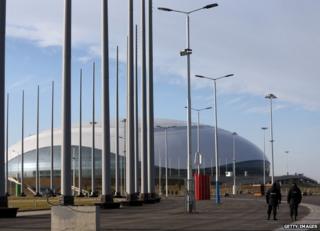 Security guards walk near the Olympic Park in Adler, Russia, 9 January